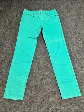 The item in the image is a pair of mint green slim-fit denim pants.